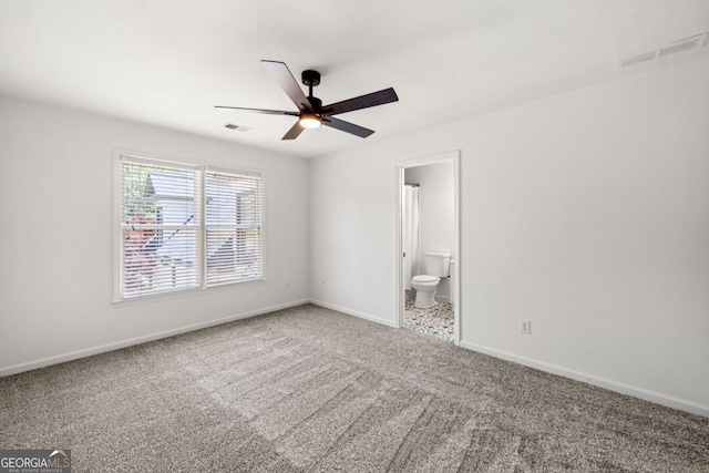 414 Dogwood Way, Canton, GA 30114 - unfurnished bedroom with carpet floors, baseboards, connected bathroom, and ceiling fan