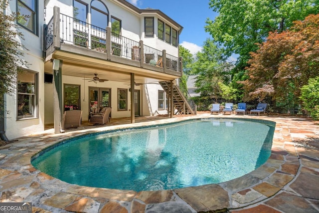 414 Dogwood Way, Canton, GA 30114 - rear view of property featuring a balcony, stucco siding, a ceiling fan, and a patio