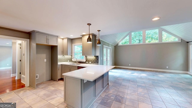 1477 Triple Creek Ct NW, Kennesaw, GA 30144 - kitchen with a sink, gray cabinets, a peninsula, light countertops, and backsplash