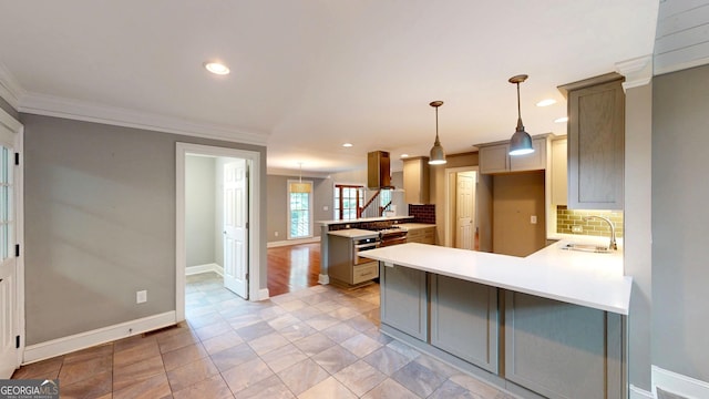 1477 Triple Creek Ct NW, Kennesaw, GA 30144 - kitchen featuring a peninsula, a sink, ornamental molding, decorative backsplash, and recessed lighting