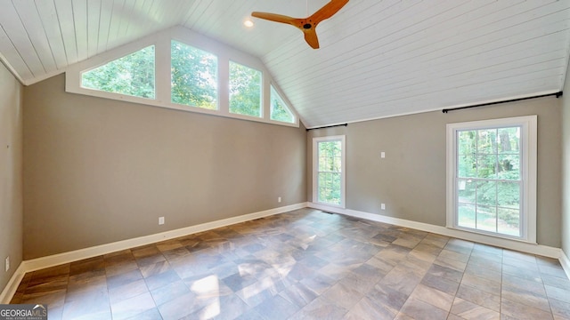 1477 Triple Creek Ct NW, Kennesaw, GA 30144 - empty room featuring plenty of natural light, baseboards, a ceiling fan, stone finish floors, and high vaulted ceiling