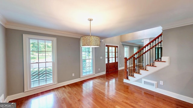 1477 Triple Creek Ct NW, Kennesaw, GA 30144 - foyer entrance featuring baseboards, wood finished floors, stairs, and ornamental molding