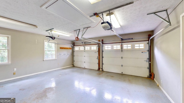 1477 Triple Creek Ct NW, Kennesaw, GA 30144 - garage with a garage door opener and baseboards