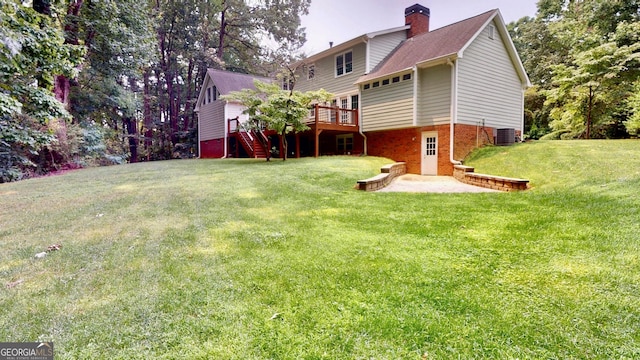 1477 Triple Creek Ct NW, Kennesaw, GA 30144 - view of grassy yard featuring a deck, central AC unit, and a patio