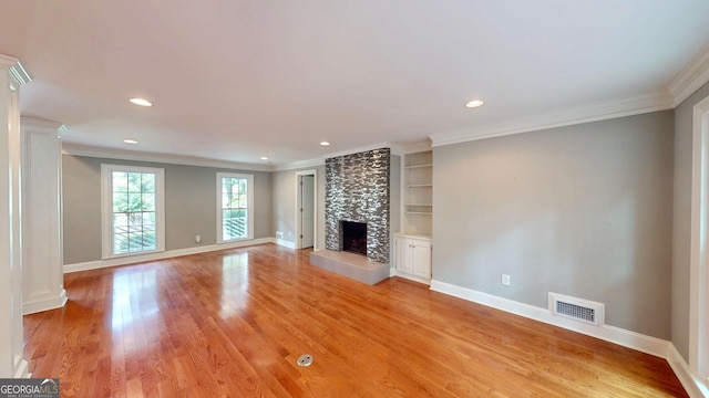 1477 Triple Creek Ct NW, Kennesaw, GA 30144 - unfurnished living room featuring ornamental molding, light wood finished floors, a tile fireplace, recessed lighting, and baseboards