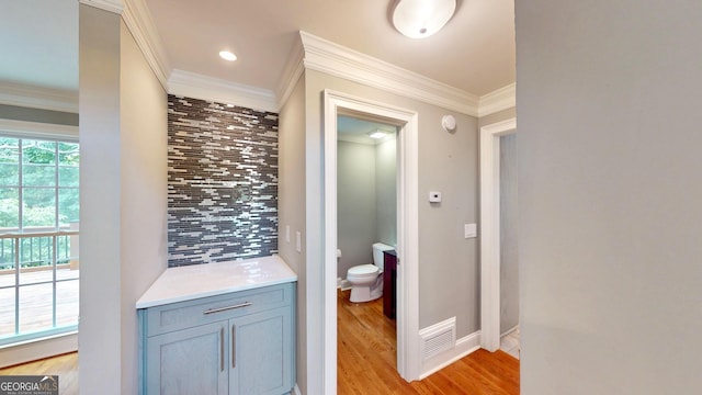 1477 Triple Creek Ct NW, Kennesaw, GA 30144 - bathroom with toilet, backsplash, wood finished floors, ornamental molding, and baseboards