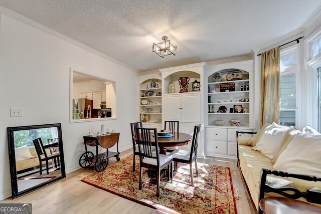 248 Riverview Trl, Roswell, GA 30075 - dining area featuring light wood-type flooring, ornamental molding, and a textured ceiling