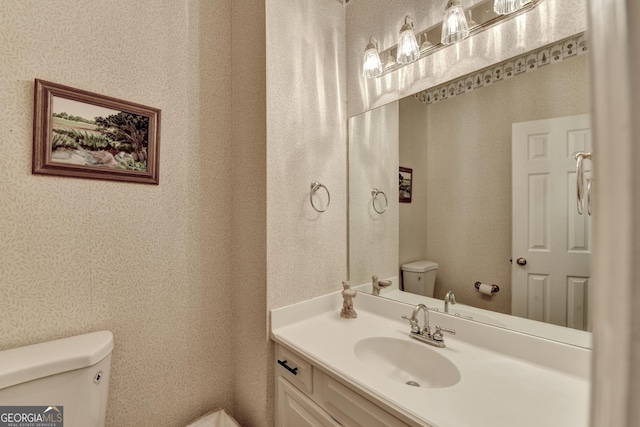 248 Riverview Trl, Roswell, GA 30075 - bathroom with toilet, vanity, and wallpapered walls