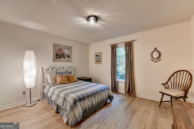 248 Riverview Trl, Roswell, GA 30075 - bedroom featuring light wood-style flooring, a textured ceiling, baseboards, and crown molding