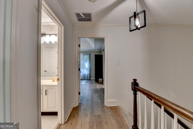 248 Riverview Trl, Roswell, GA 30075 - corridor featuring light wood finished floors, an upstairs landing, crown molding, and baseboards