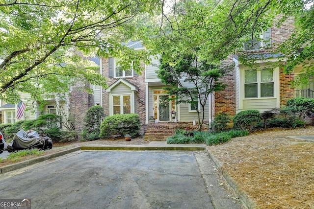 248 Riverview Trl, Roswell, GA 30075 - view of property hidden behind natural elements featuring brick siding