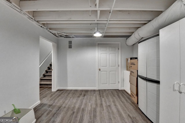 248 Riverview Trl, Roswell, GA 30075 - finished basement with wood finished floors, stairway, and baseboards
