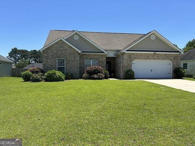109 Berkley Cir, Warner Robins, GA 31093 - view of front facade featuring brick siding, a garage, and concrete driveway