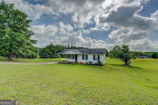 2809 S Ola Rd, Locust Grove, GA 30248 - single story home with a front lawn, driveway, and a carport