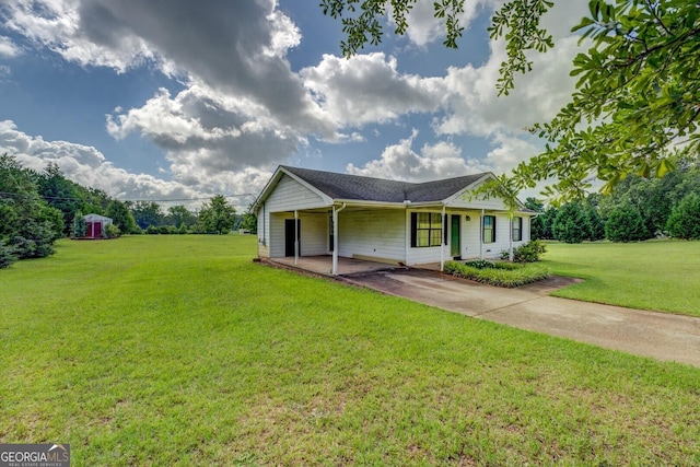2809 S Ola Rd, Locust Grove, GA 30248 - single story home featuring a front lawn, concrete driveway, and a carport