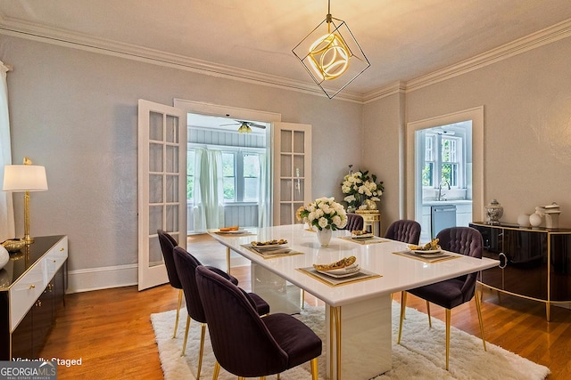 209 Forest Hill Rd, Macon, GA 31210 - dining area featuring light wood-type flooring and crown molding