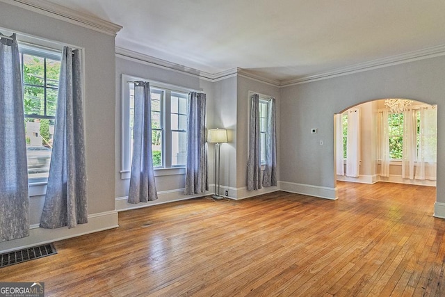 209 Forest Hill Rd, Macon, GA 31210 - unfurnished room featuring arched walkways, crown molding, and hardwood / wood-style flooring
