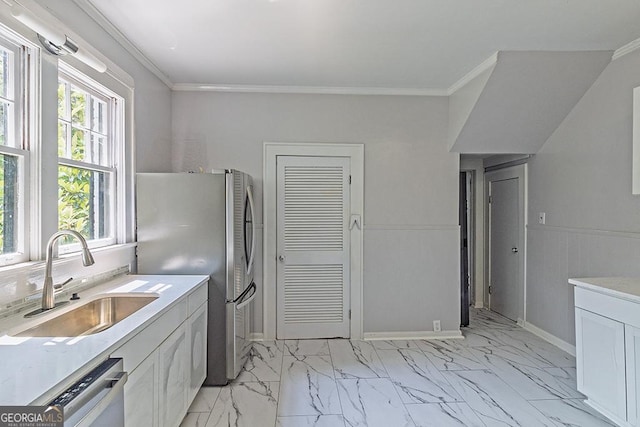209 Forest Hill Rd, Macon, GA 31210 - kitchen with stainless steel appliances, light marble finish flooring, light countertops, crown molding, and white cabinets