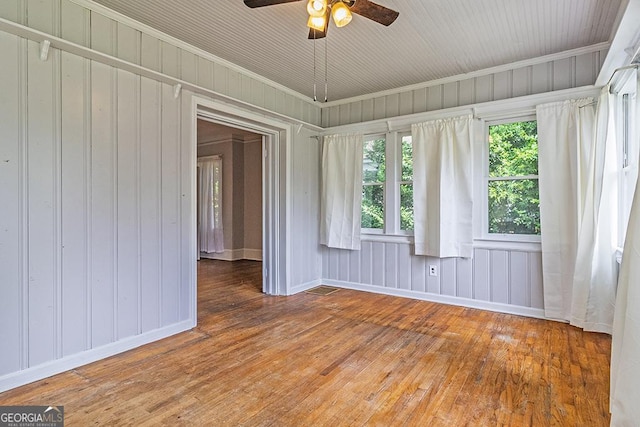 209 Forest Hill Rd, Macon, GA 31210 - spare room featuring hardwood / wood-style flooring, plenty of natural light, a ceiling fan, crown molding, and wooden walls