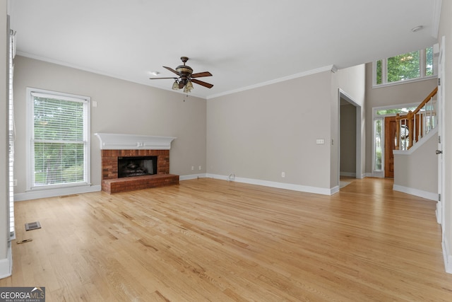 3642 Fowler Rdg, Douglasville, GA 30135 - unfurnished living room with light wood-type flooring, ceiling fan, baseboards, and ornamental molding