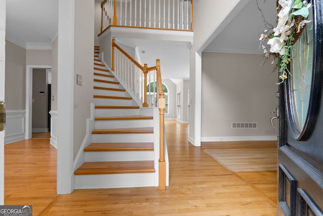 3642 Fowler Rdg, Douglasville, GA 30135 - foyer featuring crown molding, stairway, and wood finished floors