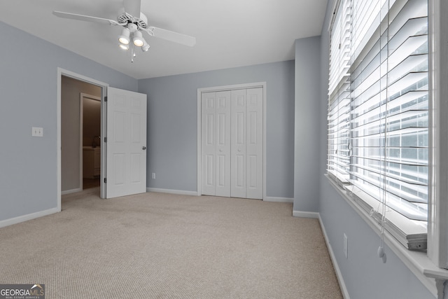 3642 Fowler Rdg, Douglasville, GA 30135 - unfurnished bedroom featuring multiple windows, light carpet, and baseboards