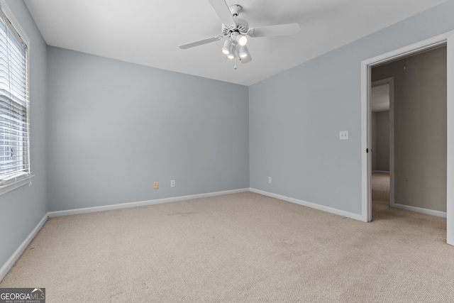 3642 Fowler Rdg, Douglasville, GA 30135 - empty room with carpet floors, ceiling fan, healthy amount of natural light, and baseboards