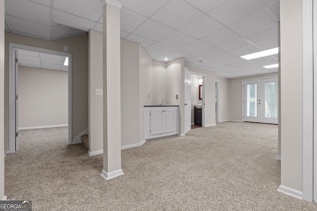 3642 Fowler Rdg, Douglasville, GA 30135 - basement with carpet flooring, a paneled ceiling, a sink, baseboards, and stairway