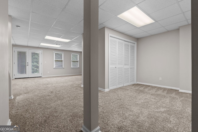 3642 Fowler Rdg, Douglasville, GA 30135 - below grade area featuring a paneled ceiling, carpet, and baseboards