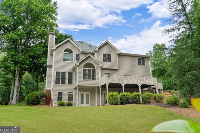 3642 Fowler Rdg, Douglasville, GA 30135 - back of property with french doors, a chimney, a yard, and a deck