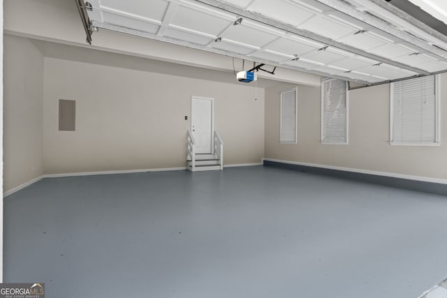 3642 Fowler Rdg, Douglasville, GA 30135 - garage with electric panel, a garage door opener, and baseboards