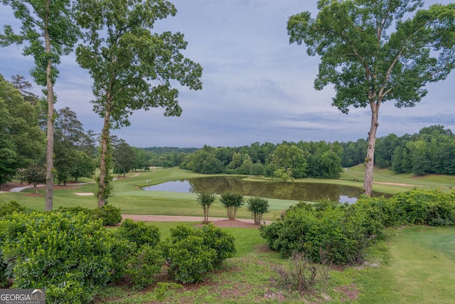 3642 Fowler Rdg, Douglasville, GA 30135 - view of community featuring a water view, view of golf course, a yard, and view of wooded area
