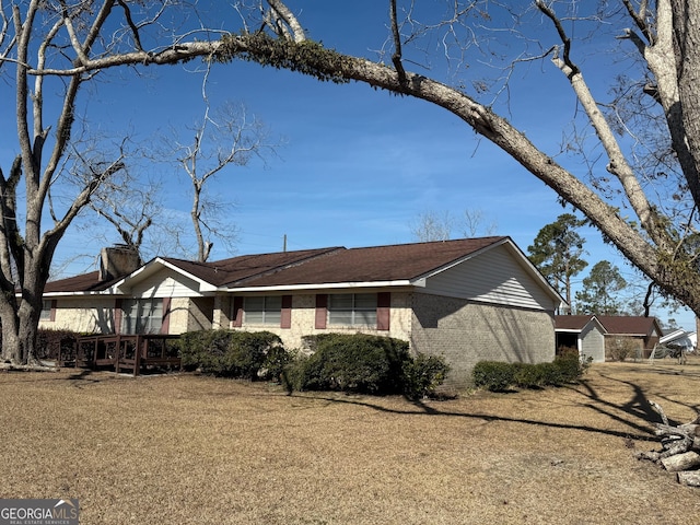 3 E Kelly Ln, Hazlehurst, GA 31539 - view of front of property with a wooden deck and brick siding