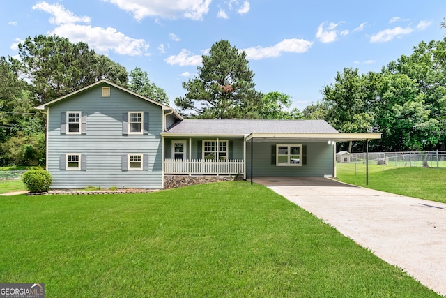 320 Edna Dr, Stockbridge, GA 30281 - split level home featuring driveway, an attached carport, and covered porch