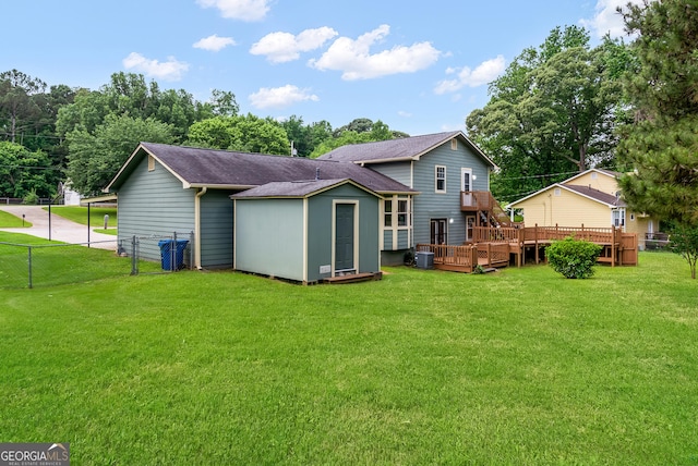 320 Edna Dr, Stockbridge, GA 30281 - rear view of property featuring a wooden deck, roof with shingles, and central air condition unit