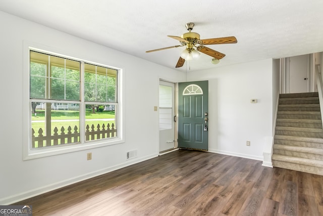 320 Edna Dr, Stockbridge, GA 30281 - foyer featuring dark wood finished floors, a ceiling fan, stairway, and baseboards