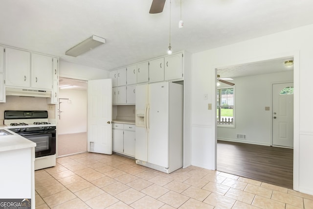 320 Edna Dr, Stockbridge, GA 30281 - kitchen with white refrigerator with ice dispenser, a ceiling fan, gas range oven, and under cabinet range hood