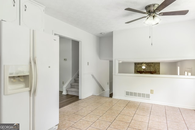 320 Edna Dr, Stockbridge, GA 30281 - empty room featuring a ceiling fan, light tile patterned floors, and a textured ceiling