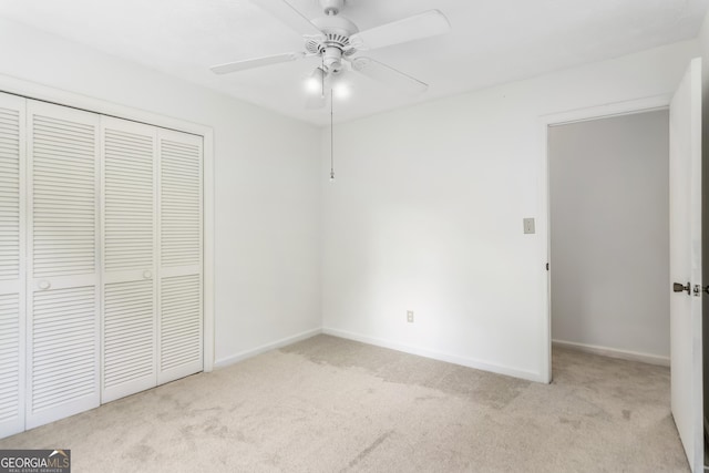 320 Edna Dr, Stockbridge, GA 30281 - unfurnished bedroom featuring carpet floors, a closet, baseboards, and a ceiling fan