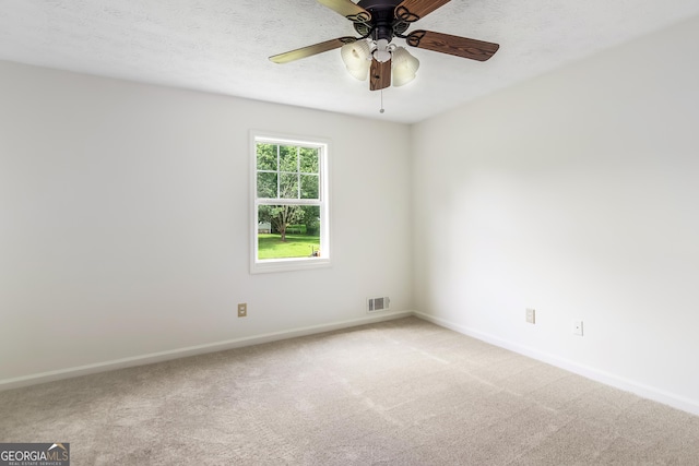 320 Edna Dr, Stockbridge, GA 30281 - spare room featuring baseboards, light colored carpet, and a ceiling fan