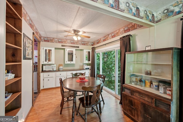 293 Timber Ridge Dr, Athens, GA 30607 - dining area with ceiling fan, light wood-style floors, and a textured ceiling