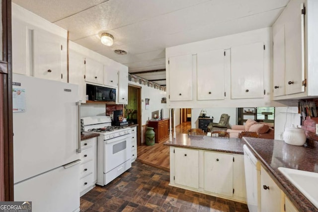 293 Timber Ridge Dr, Athens, GA 30607 - kitchen with white appliances, stone finish floors, a sink, and white cabinetry