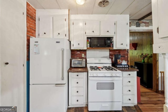 293 Timber Ridge Dr, Athens, GA 30607 - kitchen with white appliances, white cabinets, dark wood-style floors, dark countertops, and decorative backsplash