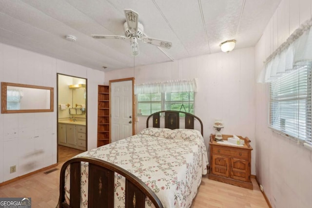 293 Timber Ridge Dr, Athens, GA 30607 - bedroom featuring light wood finished floors, ensuite bathroom, and ceiling fan