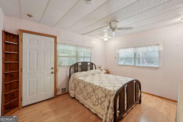 293 Timber Ridge Dr, Athens, GA 30607 - bedroom with light wood finished floors and ceiling fan