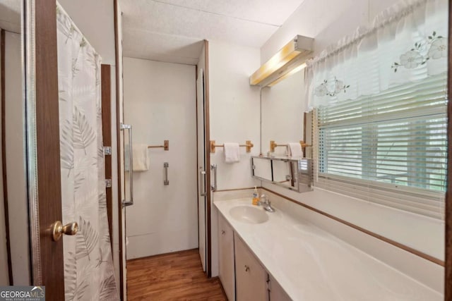 293 Timber Ridge Dr, Athens, GA 30607 - full bath with vanity, wood finished floors, and a shower with shower curtain