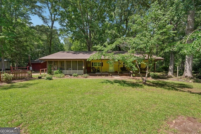293 Timber Ridge Dr, Athens, GA 30607 - rear view of property featuring a sunroom, a lawn, and metal roof
