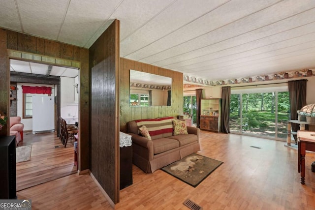 293 Timber Ridge Dr, Athens, GA 30607 - living room featuring wooden walls and wood finished floors