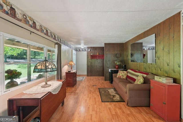 293 Timber Ridge Dr, Athens, GA 30607 - living area with wooden walls and light wood finished floors
