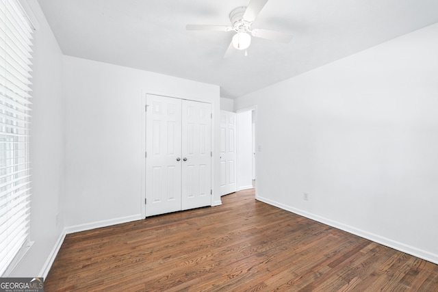 3210 Roseheath Ln, Lithonia, GA 30038 - unfurnished bedroom featuring wood finished floors, baseboards, a closet, and a ceiling fan